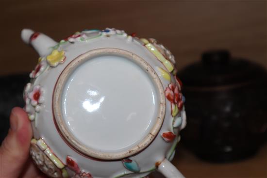 An 18th century Chinese Export famille rose teapot, cover and a similar dish